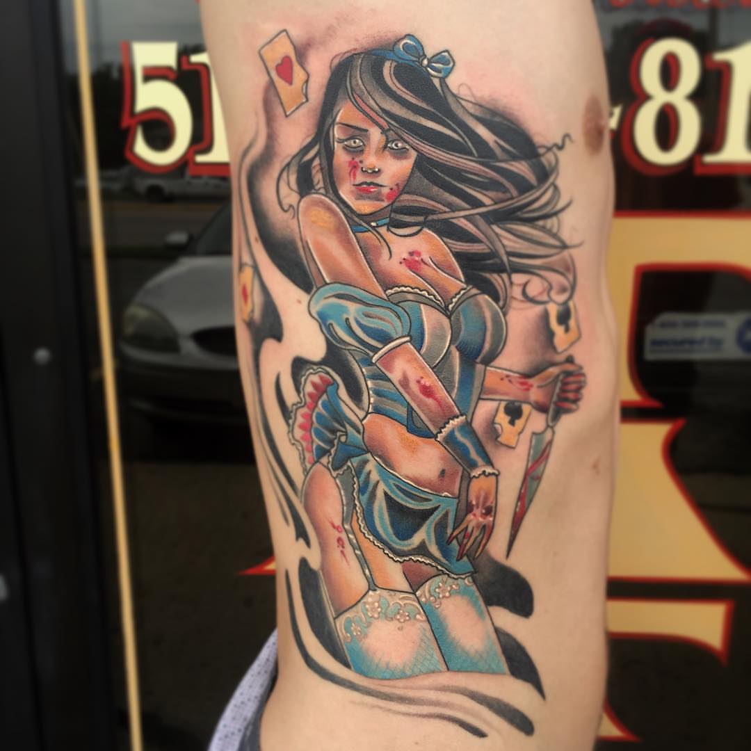 Woman in blue dress American traditional tattoo on the forearm by Derek Hutchison, Des Moines, Iowa