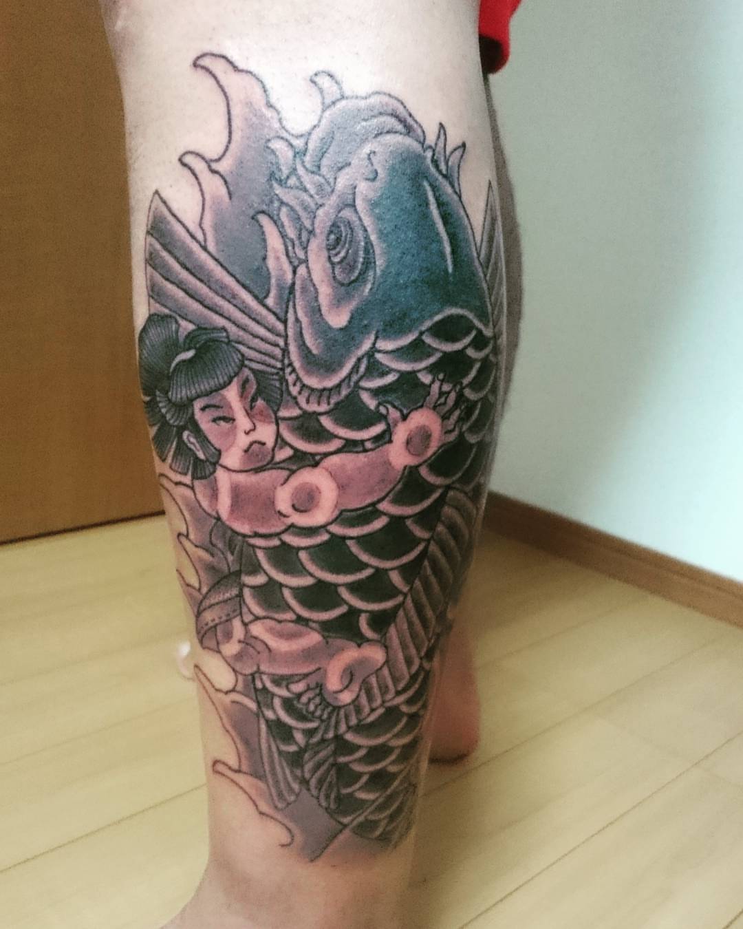Koi fish and geisha japanese irezumi tattoo on the calf by Daichi Horiyama