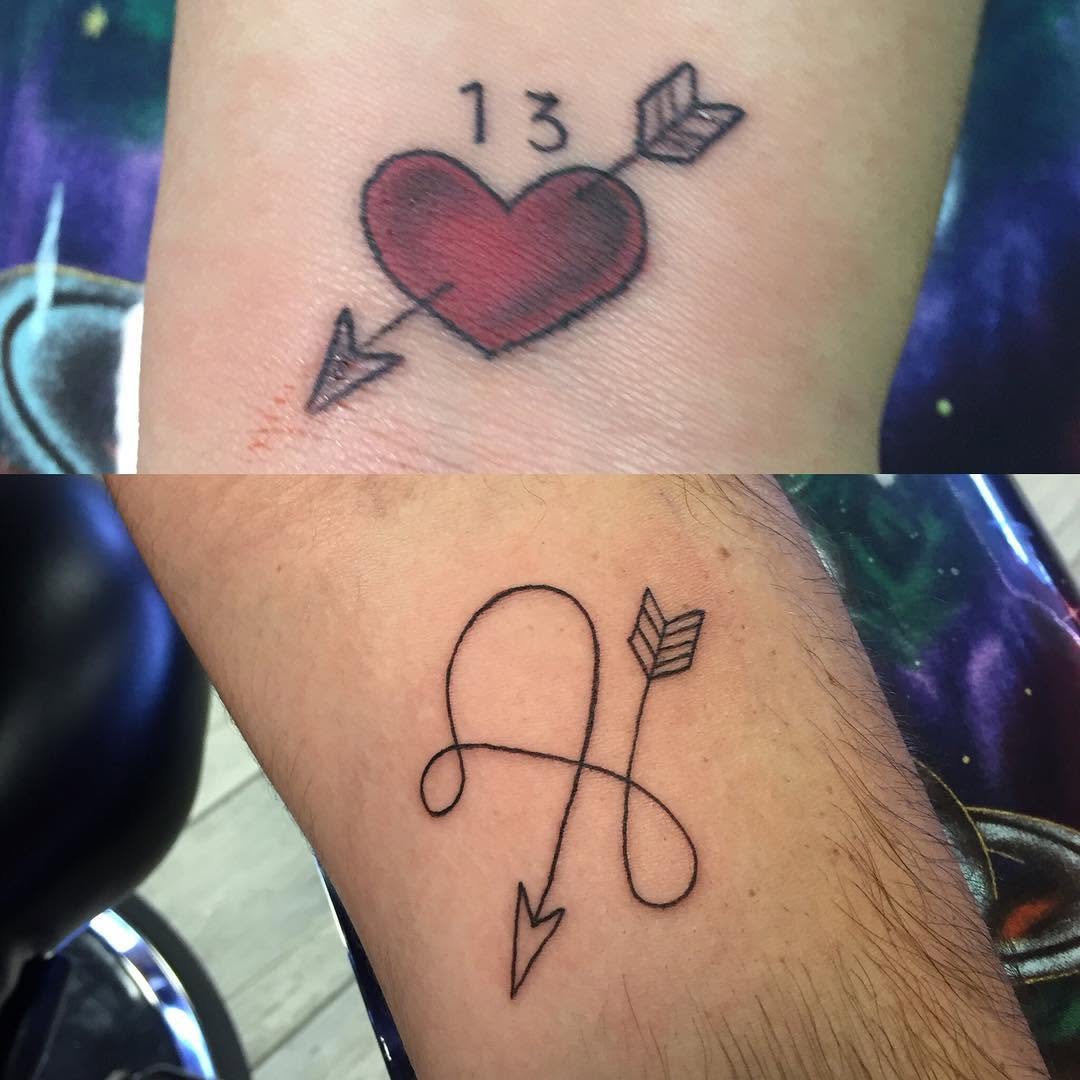 Heart with arrow and number minimalist tattoo on the forearm by Chris