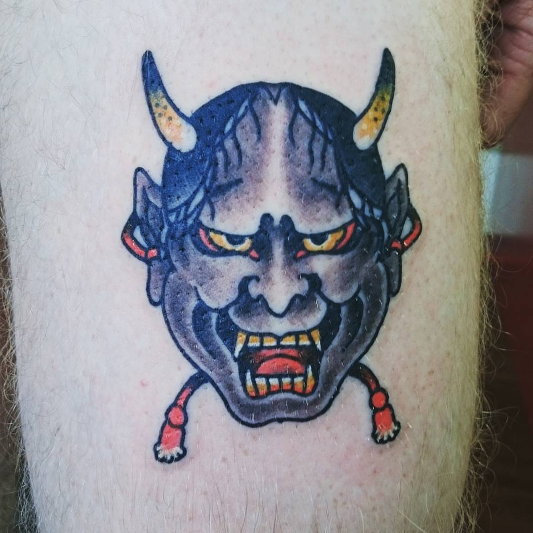 Demon mask American traditional tattoo on the forearm by Daichi Horiyama