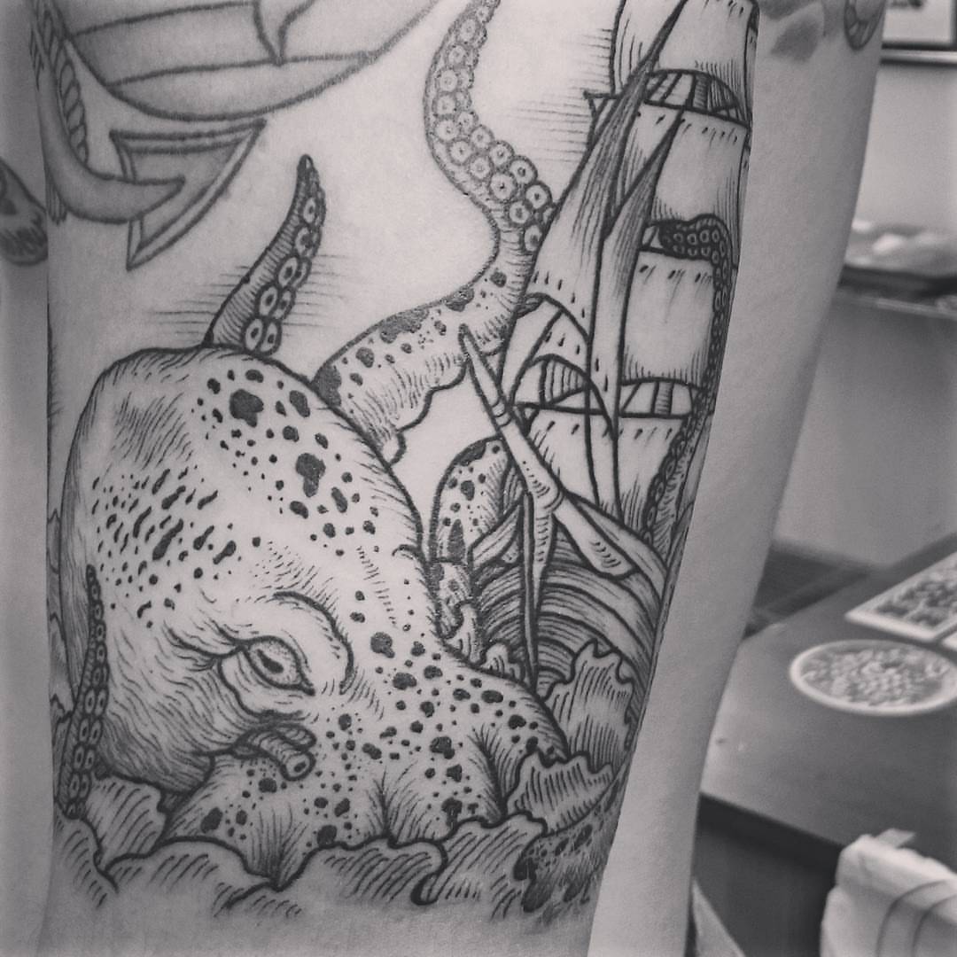 Octopus and ship realism tattoo on the forearm by Daichi Horiyama