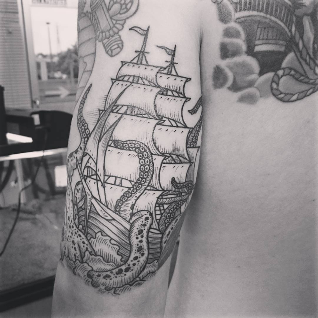 Ship and octopus American traditional tattoo on the forearm by Daichi Horiyama