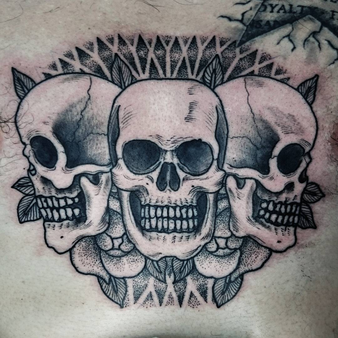 Skulls dotwork tattoo on the torso by Daichi Horiyama