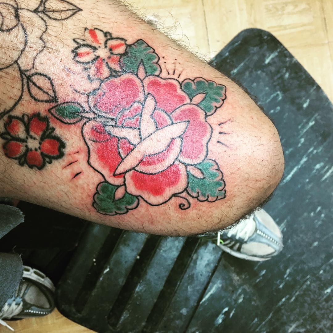 Floral bouquet American traditional tattoo on the forearm by Rashaun Collins