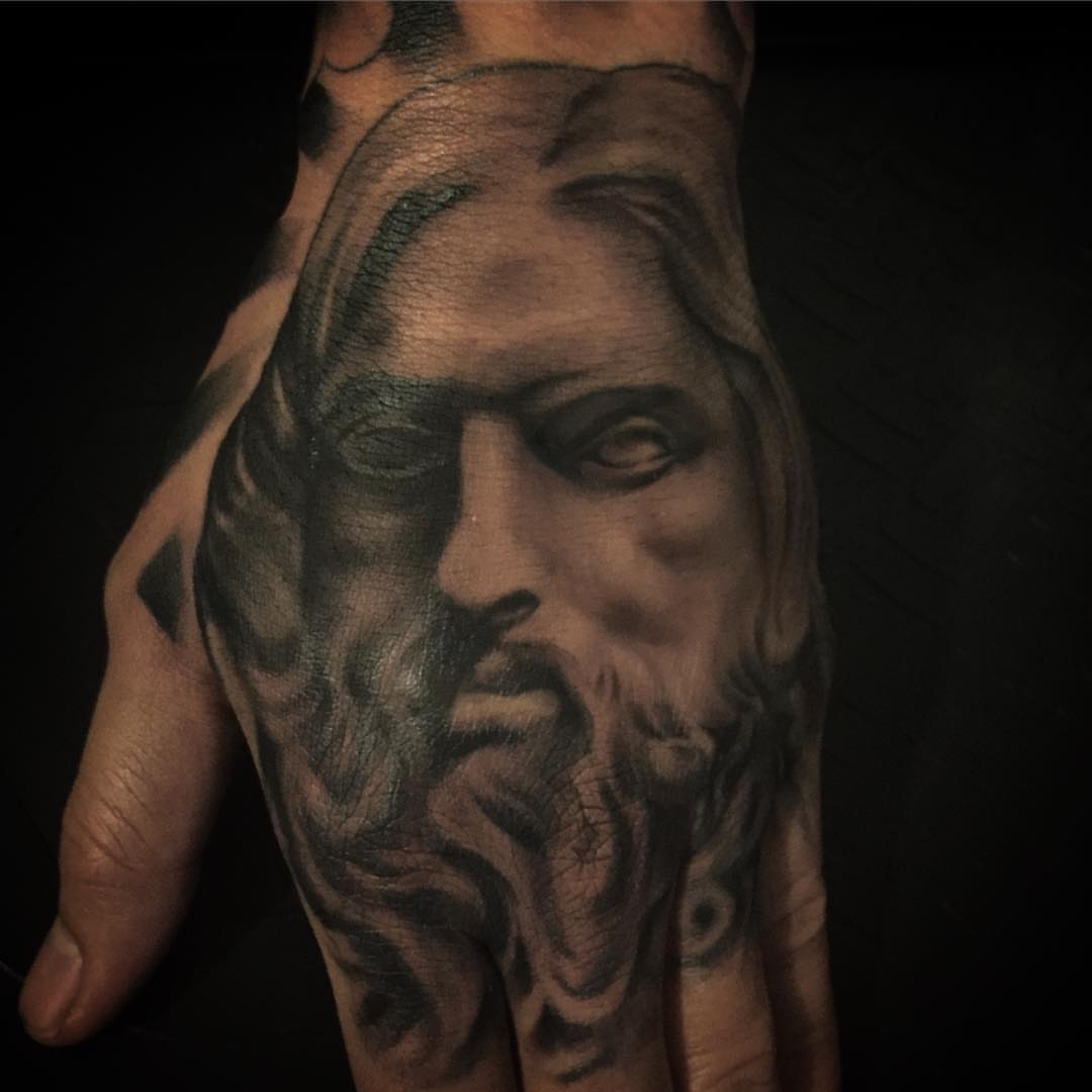 Religious figure realism tattoo on the hand by Rocky Nguyen DFW Dallas Japanese