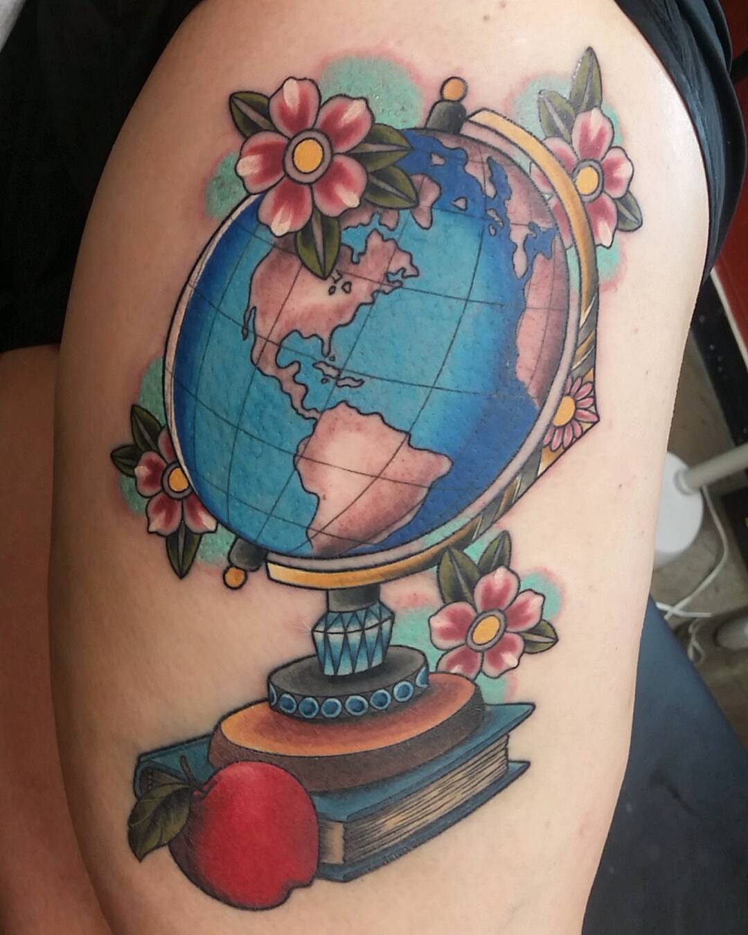 Globe American traditional tattoo on the shoulder by Dustin Lane Collins