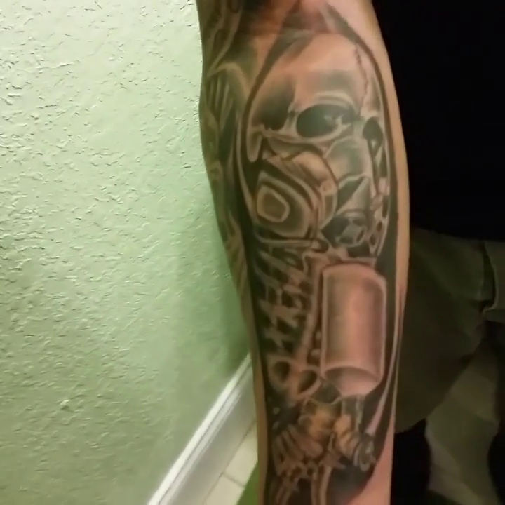Skull and gas mask realism tattoo by Tattoos By Mauze