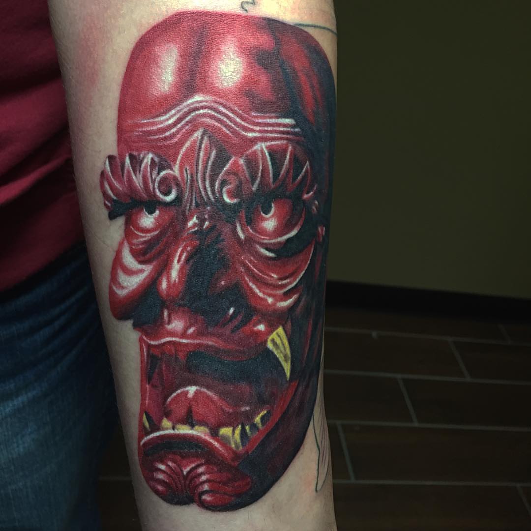 Demon face dark realism tattoo on the forearm by Joe Shepp