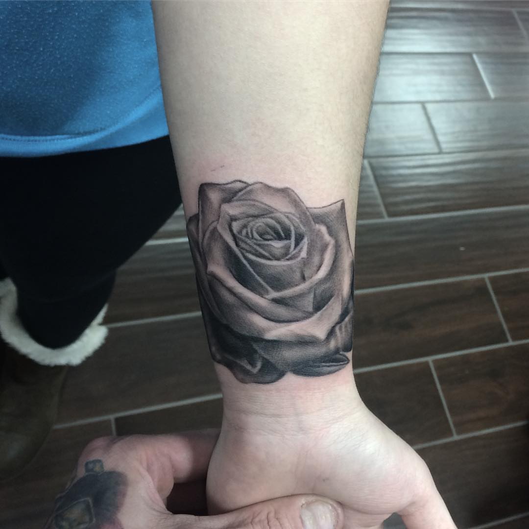 Rose black and grey tattoo on the forearm by Joe Shepp