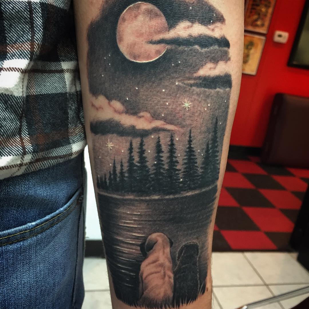 Lake and night sky realism tattoo on the forearm by Jared Ammons