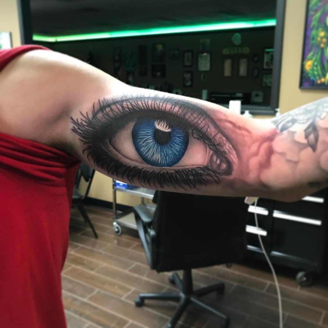 Eye realism tattoo on the forearm by Joe Shepp
