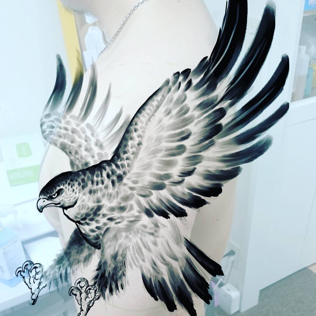 Hawk black and grey tattoo on the chest by Daichi Horiyama