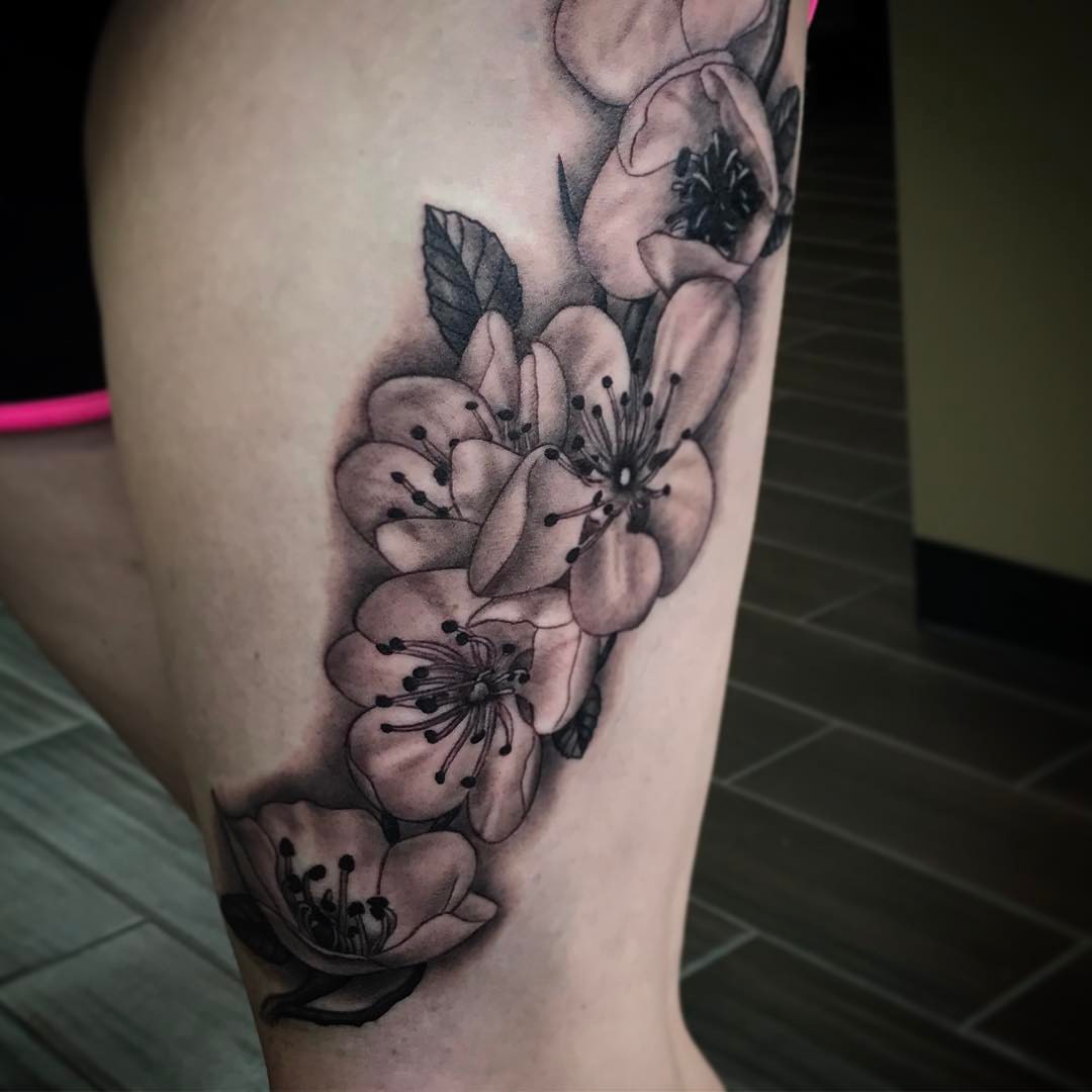 Cherry blossoms black and grey tattoo on the forearm by Joe Shepp