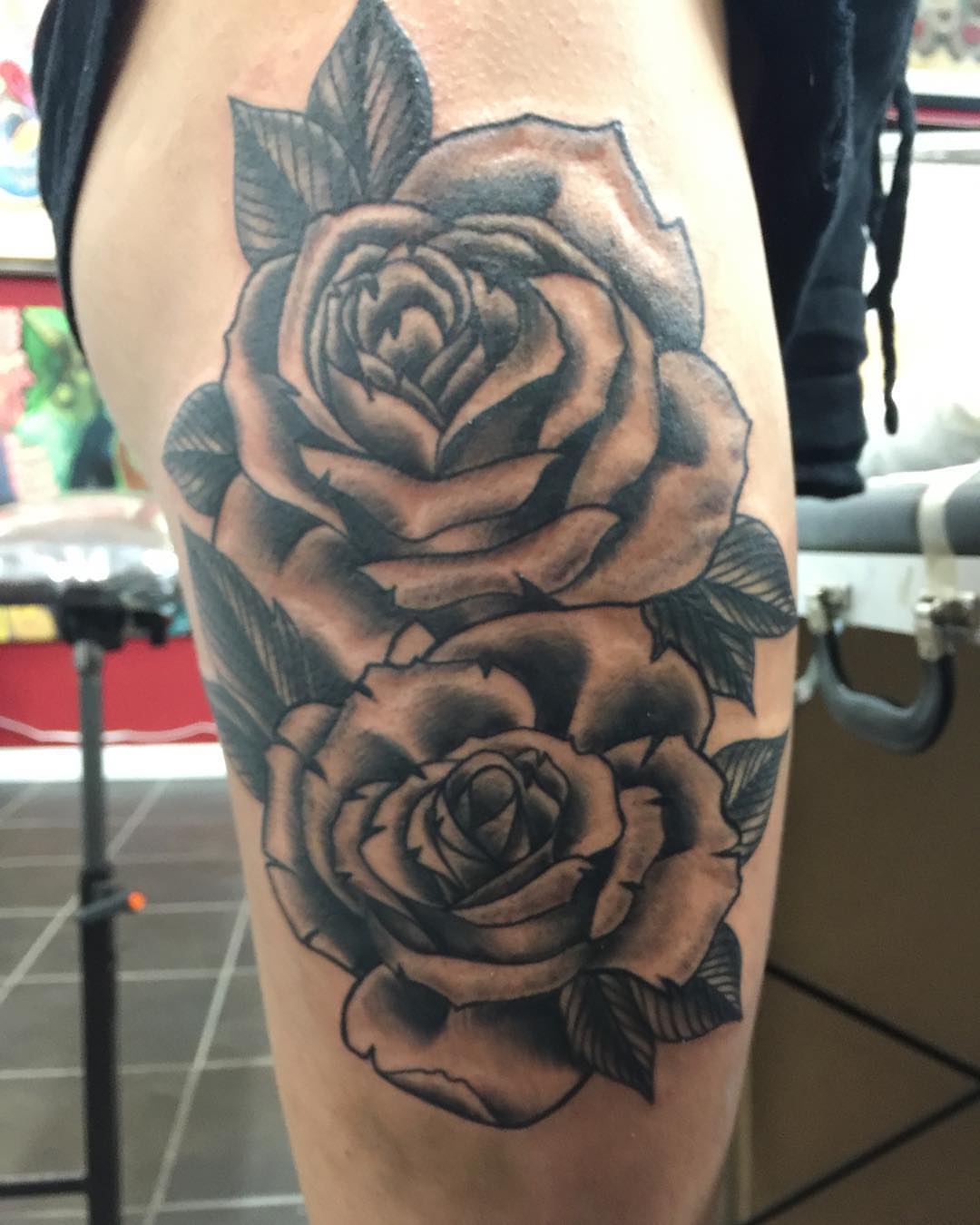 Roses black and grey tattoo on the thigh by Jason L.