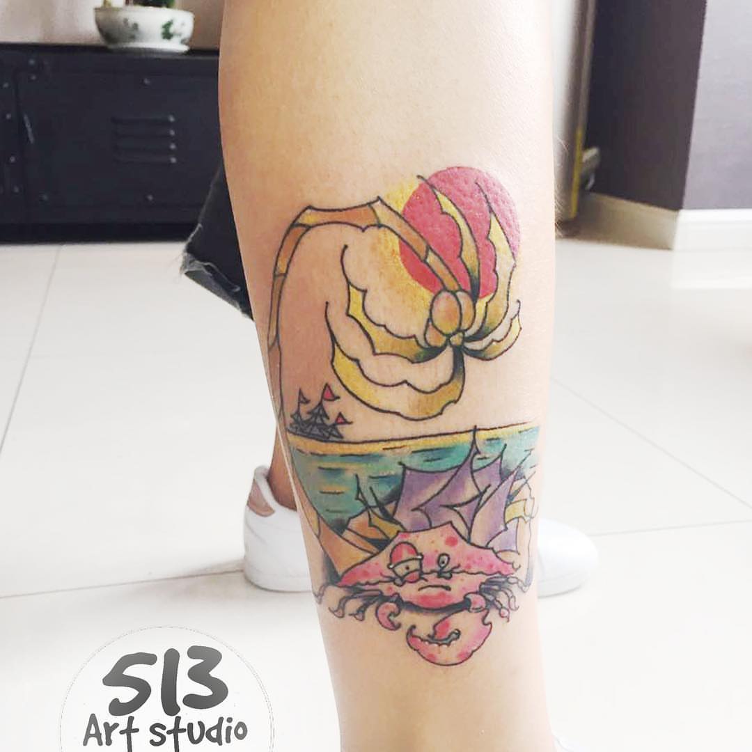 Crab and sunset watercolor tattoo on the leg by 中国🇨🇳沈阳513TATTOO