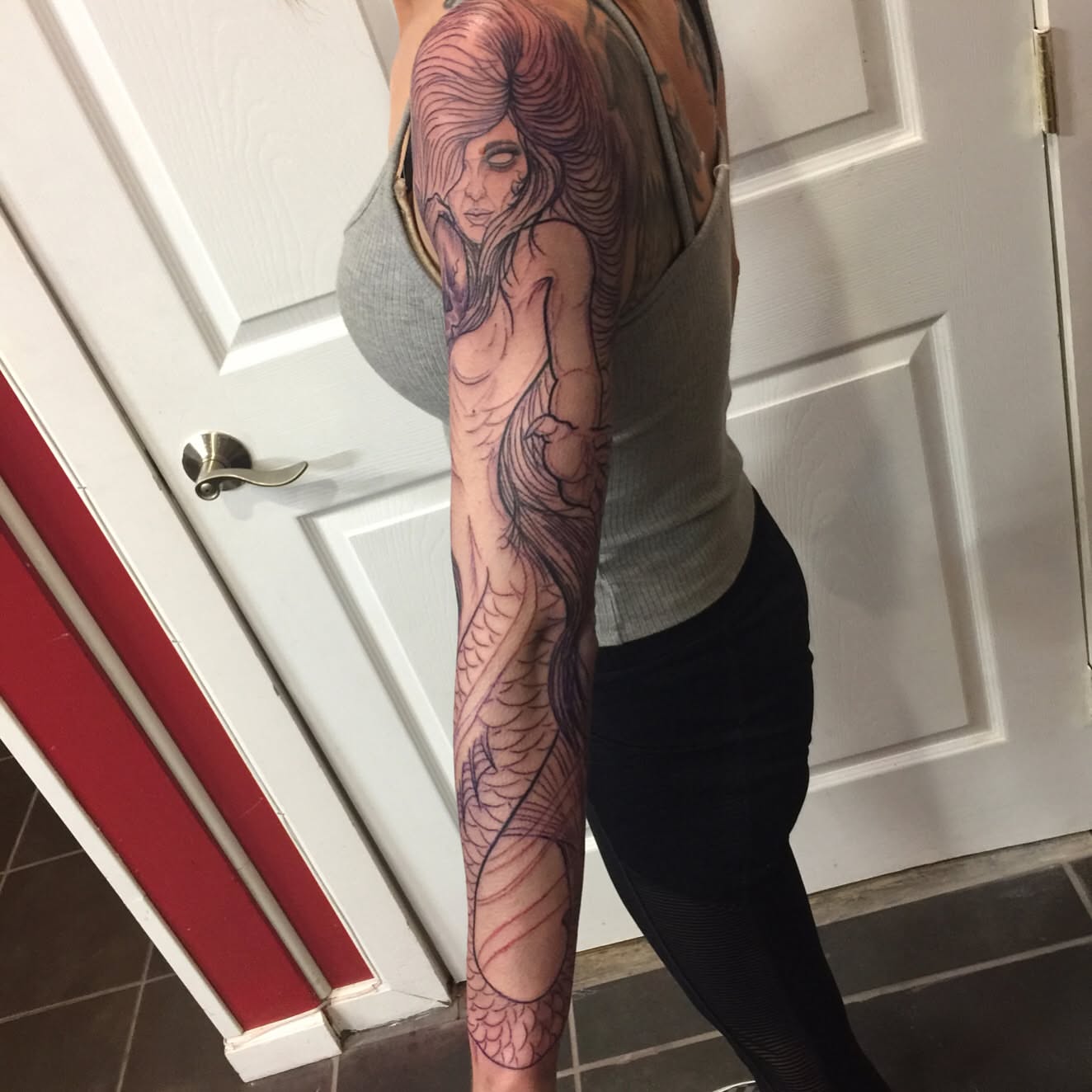 Mermaid realism tattoo on the forearm by Jason L.