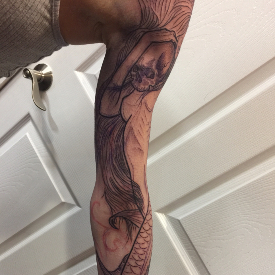 Mermaid realism tattoo on the forearm by Jason L.