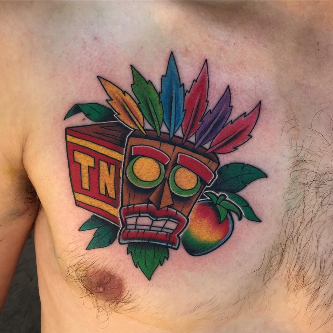 Tiki mask American traditional tattoo on the chest by Blake Chambers