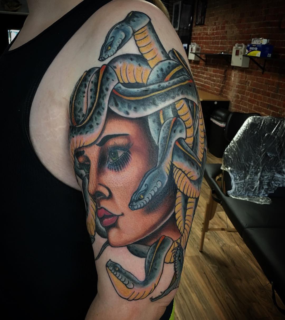 Woman with snakes American traditional tattoo on the shoulder by Kody Miller Tattoos 📍Kansas City MO Tattoo, Kansas City, Missouri