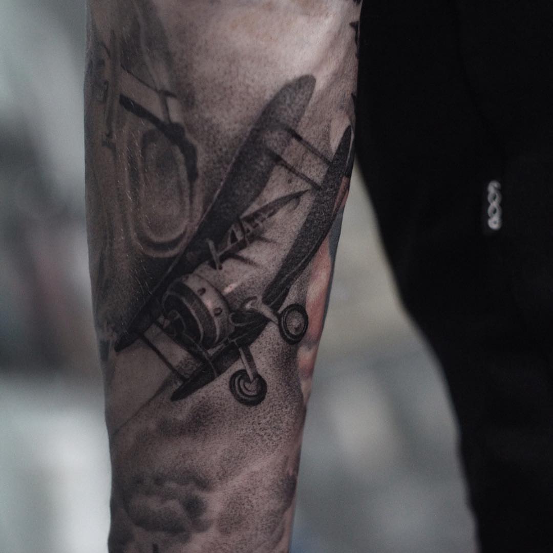 Biplane dotwork tattoo on the forearm by Anna Chernova, San Francisco, California