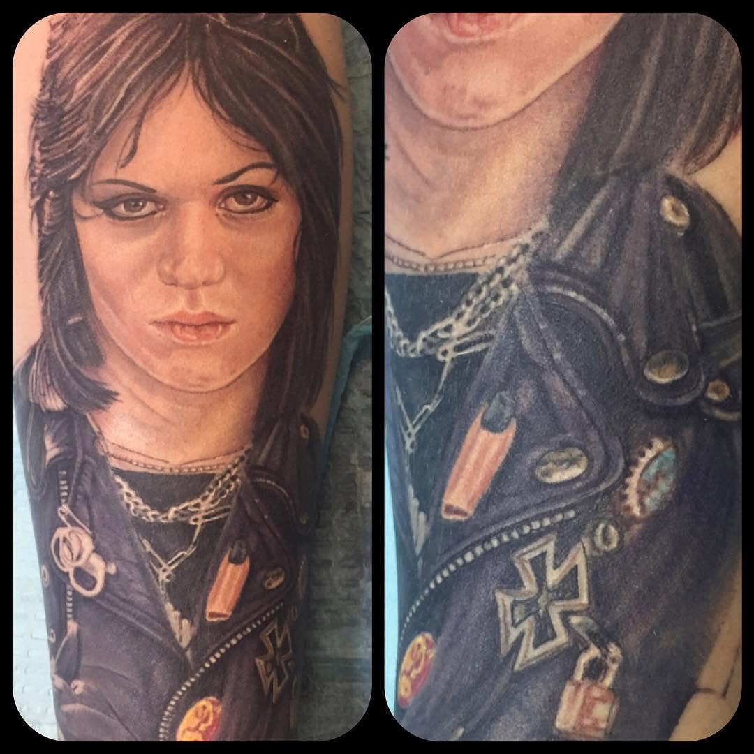 Joan Jett portrait tattoo on the upper arm by Steve Peace Calgary based tattoo artist, Calgary, Alberta