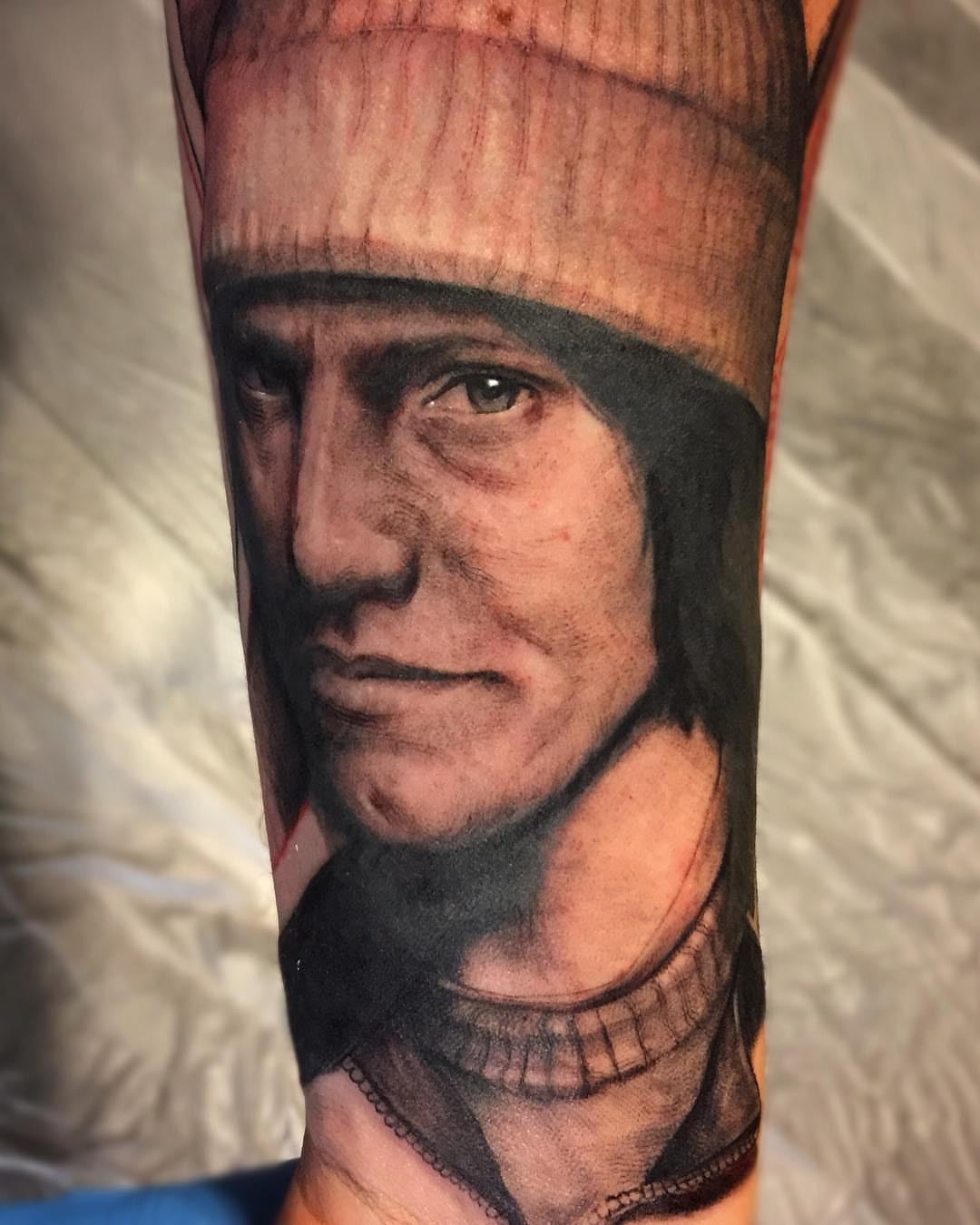 Portrait realism tattoo on the forearm by @doctorze