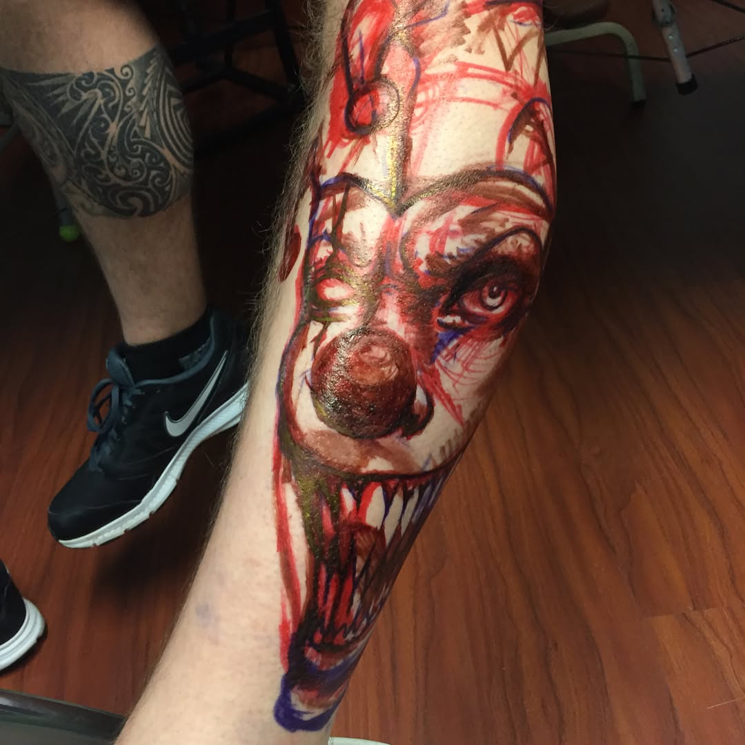 Zombie clown dark realism tattoo on the forearm by @doctorze