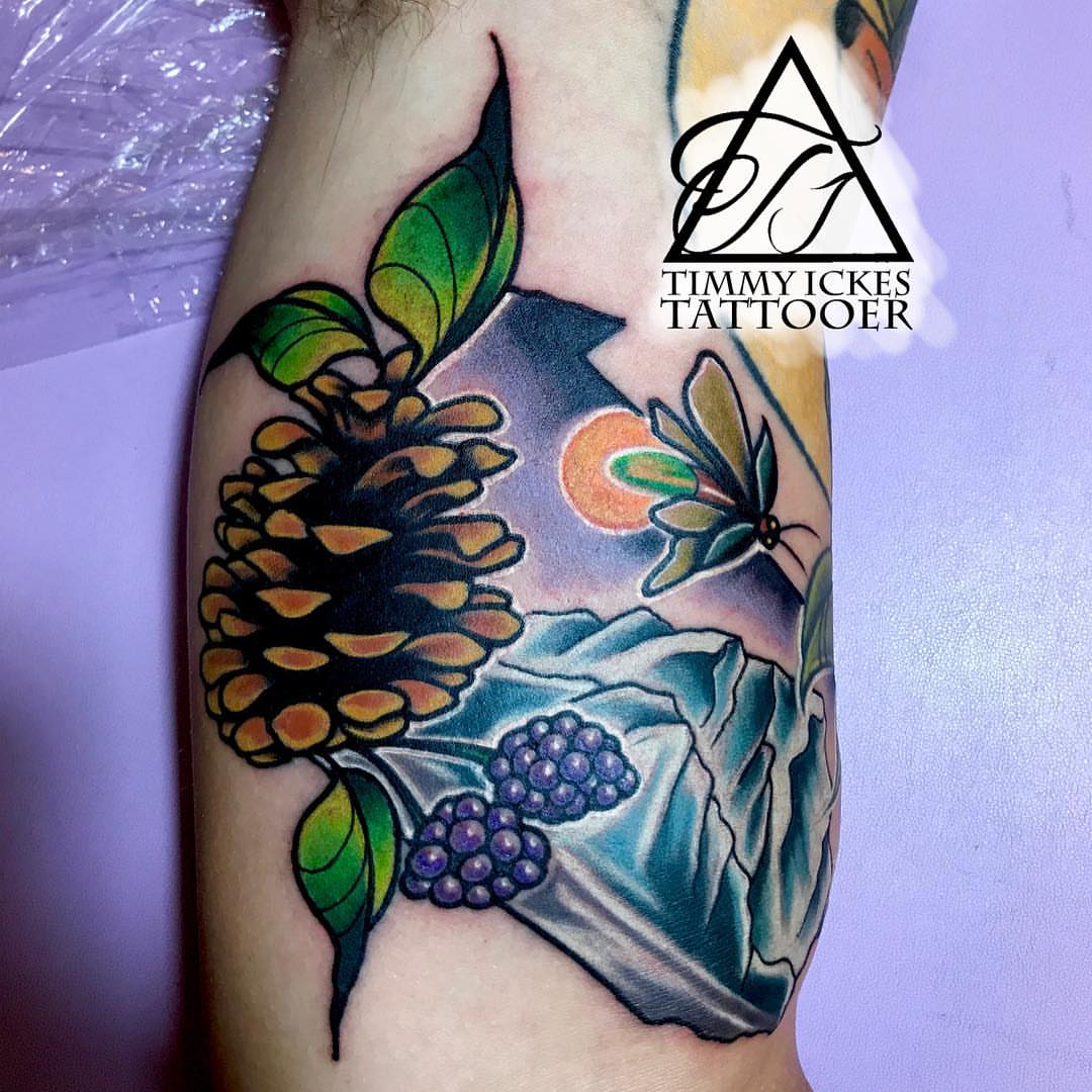 Pinecone and butterfly American traditional tattoo on the forearm by Timmy Ickes