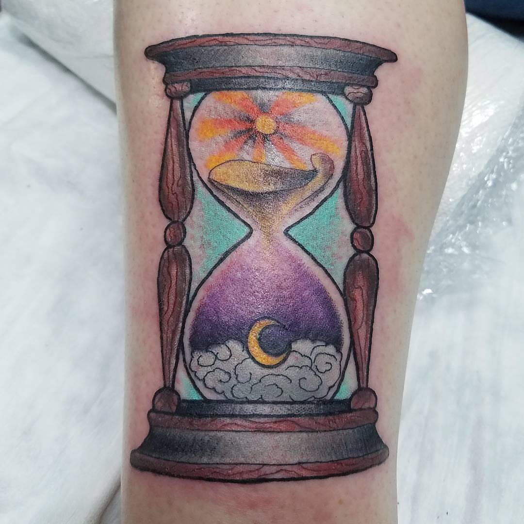 Hourglass watercolor tattoo on the forearm by Dick Eckman
