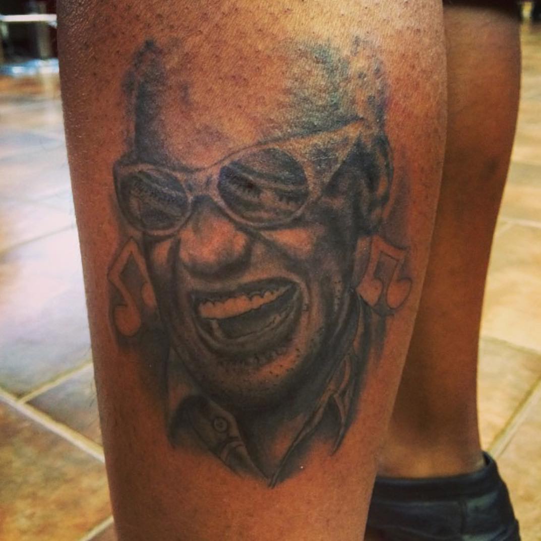 Jazz musician realism tattoo on the forearm by Sly Davis