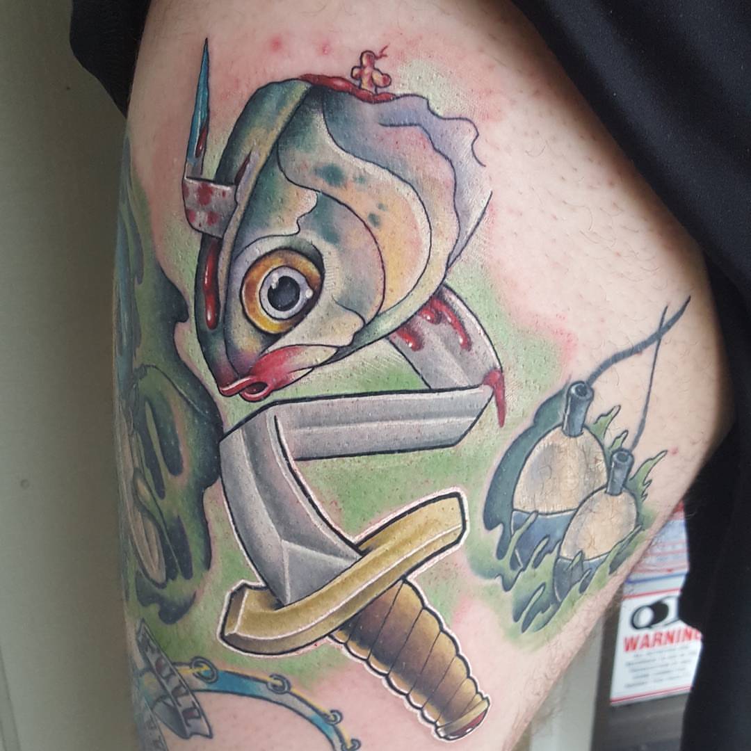 Fish American traditional tattoo on the thigh by Jon Goad