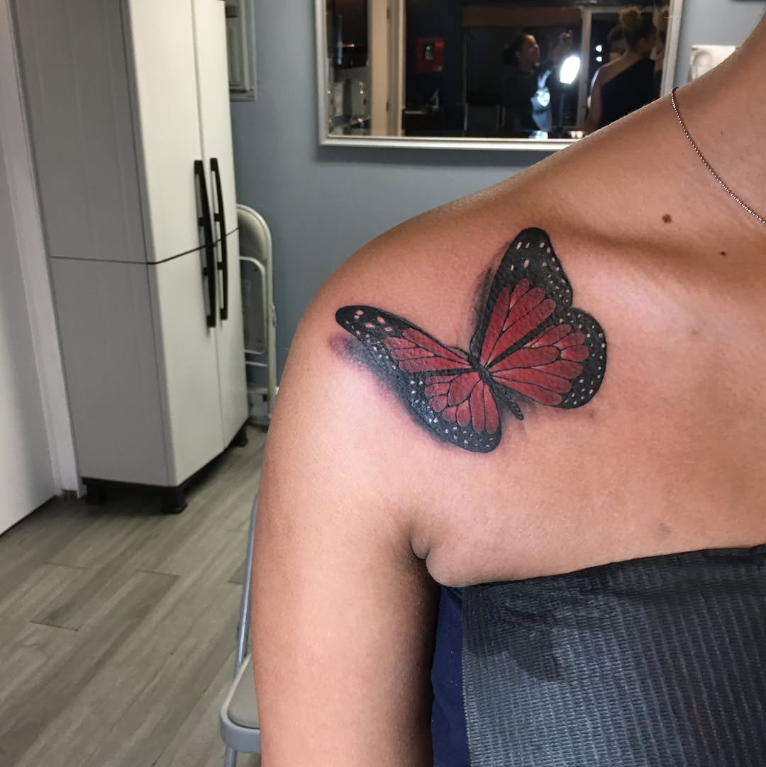 Red butterfly fine line tattoo on the shoulder by 2realink - Tattoo Artist
