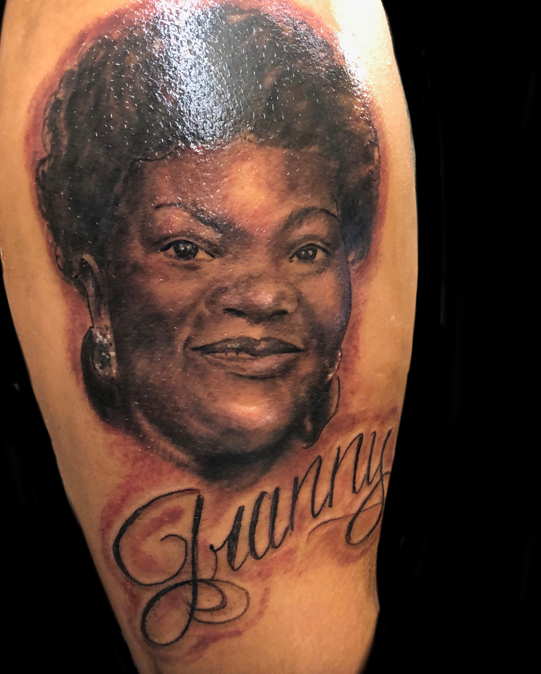 Portrait realism tattoo on the forearm by Sly Davis