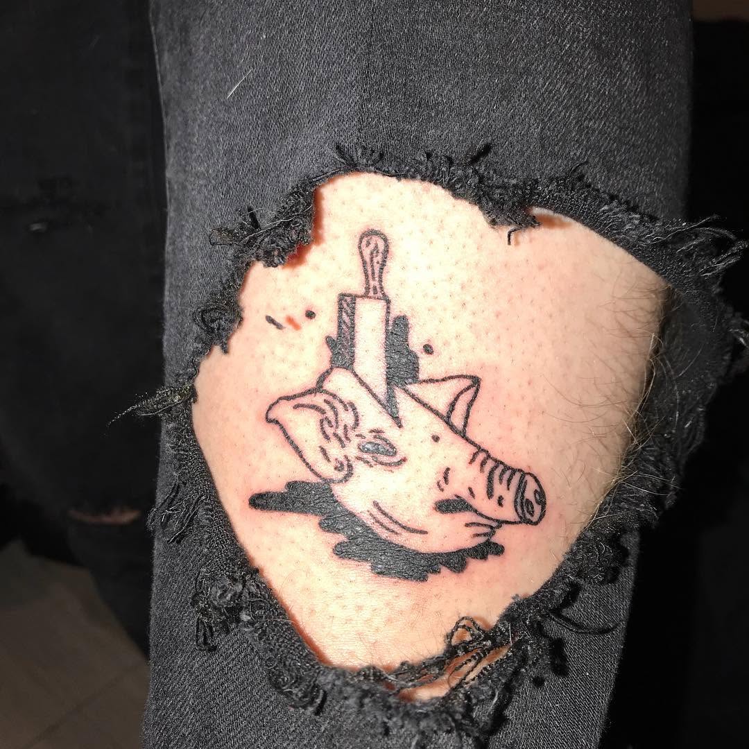 Pig head with knife minimalist tattoo on the forearm by @beantowntats