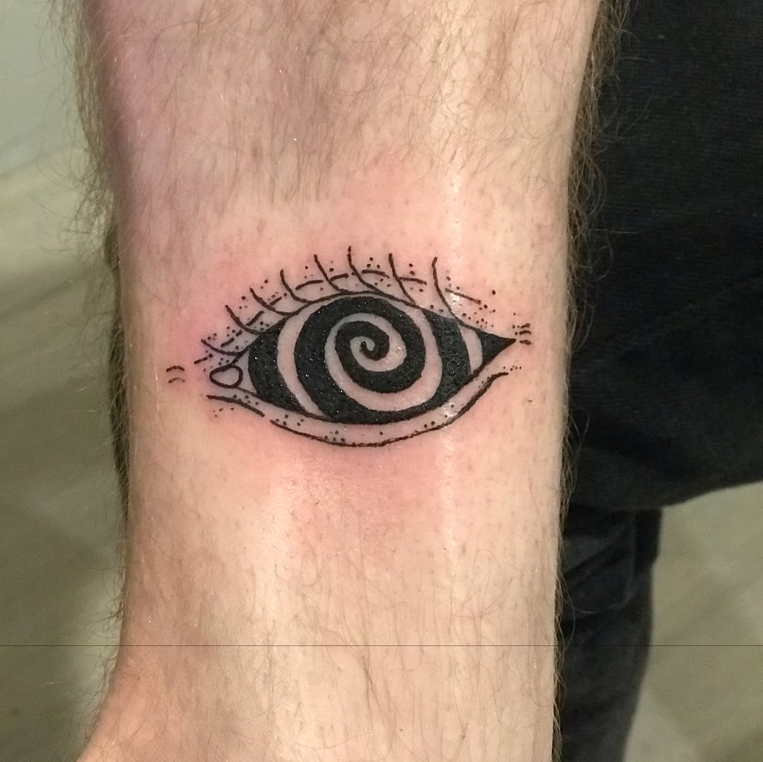 Hypnotic eye dotwork tattoo on the forearm by @beantowntats