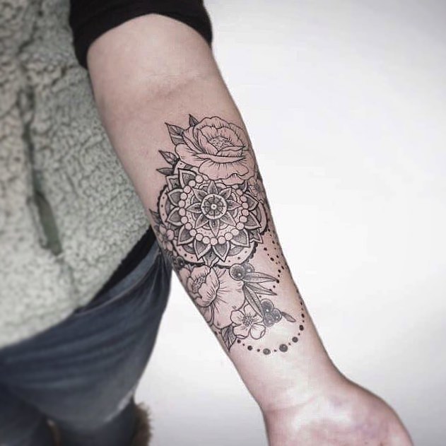Floral mandala dotwork tattoo on the forearm by Michigan Tattoo Artist