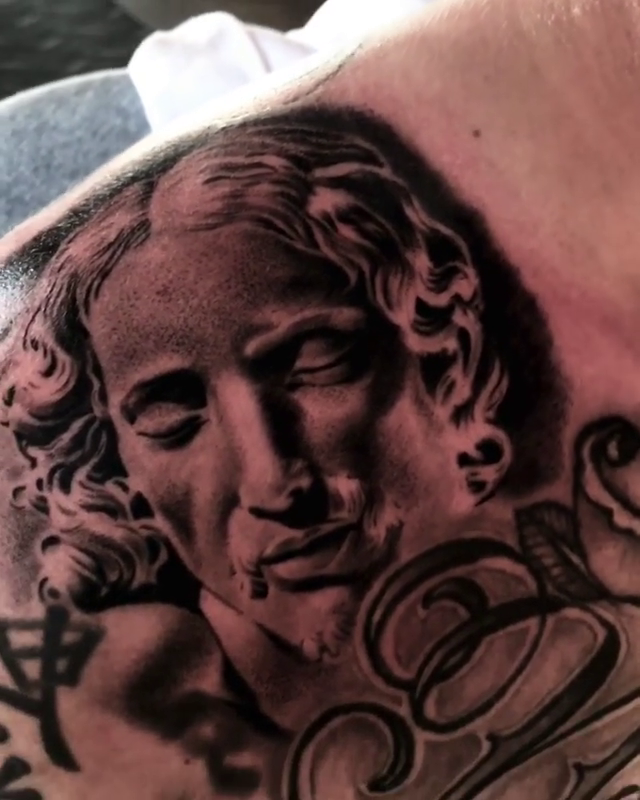 Bust of a classical figure realism tattoo by Carlos Macedo Tattoo