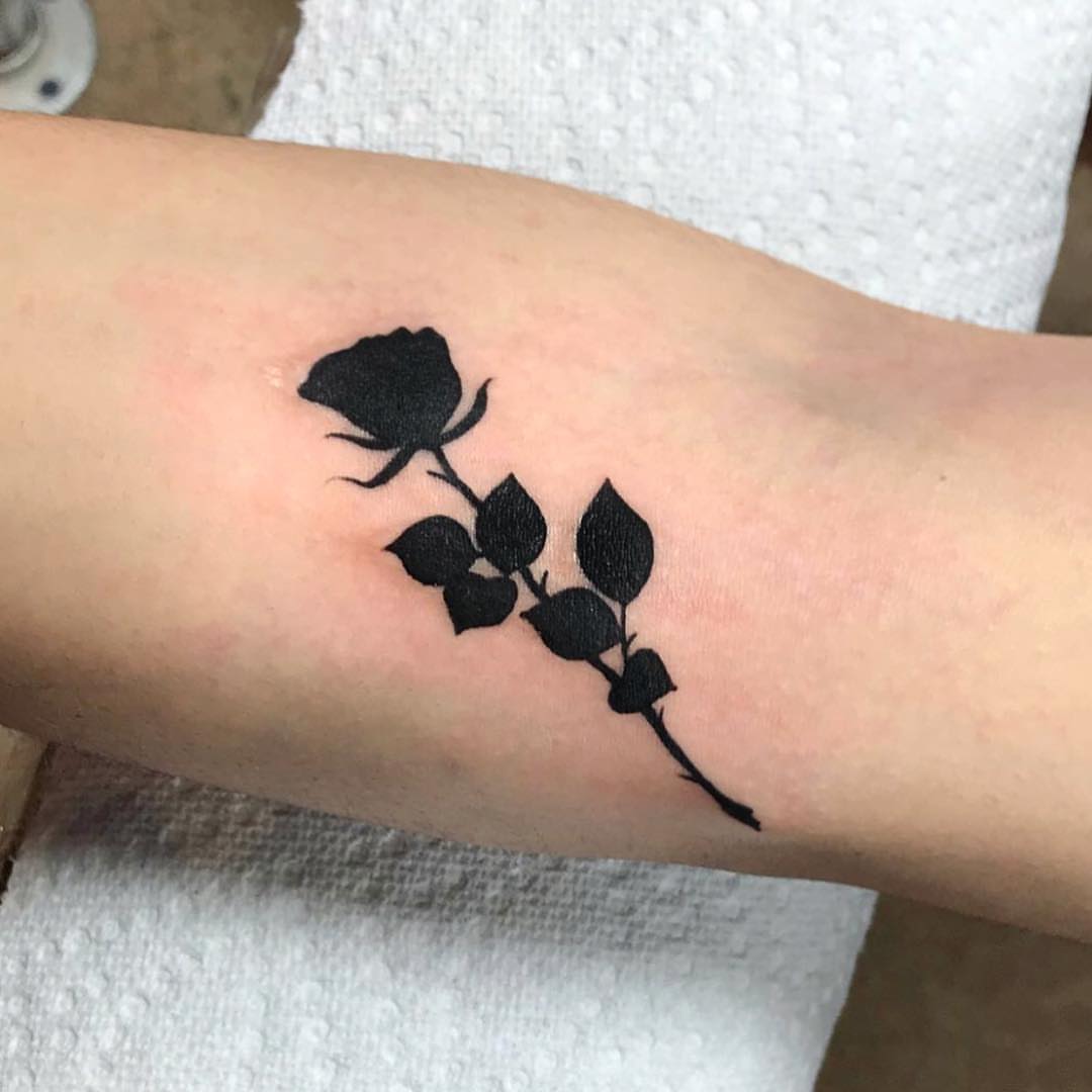Rose black and grey tattoo on the forearm by Danielle Dubois