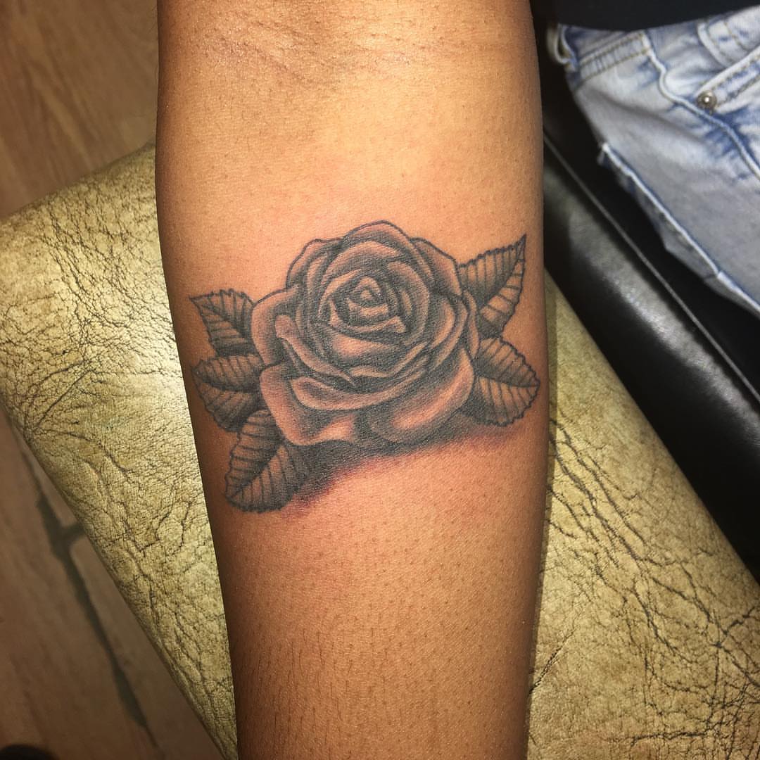 Rose black and grey tattoo on the forearm by Zac Presley