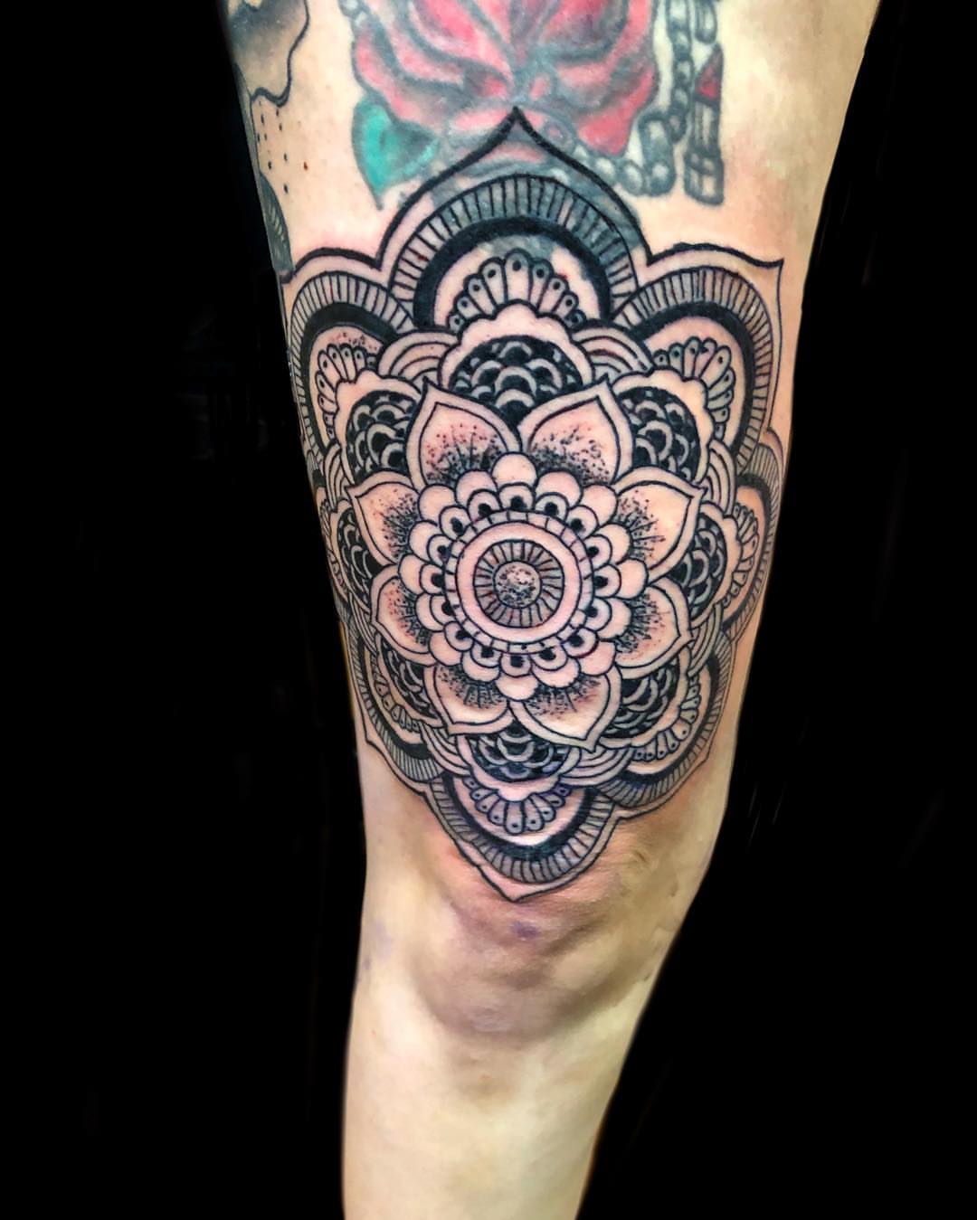 Mandala black and grey tattoo on the forearm by Sly Davis