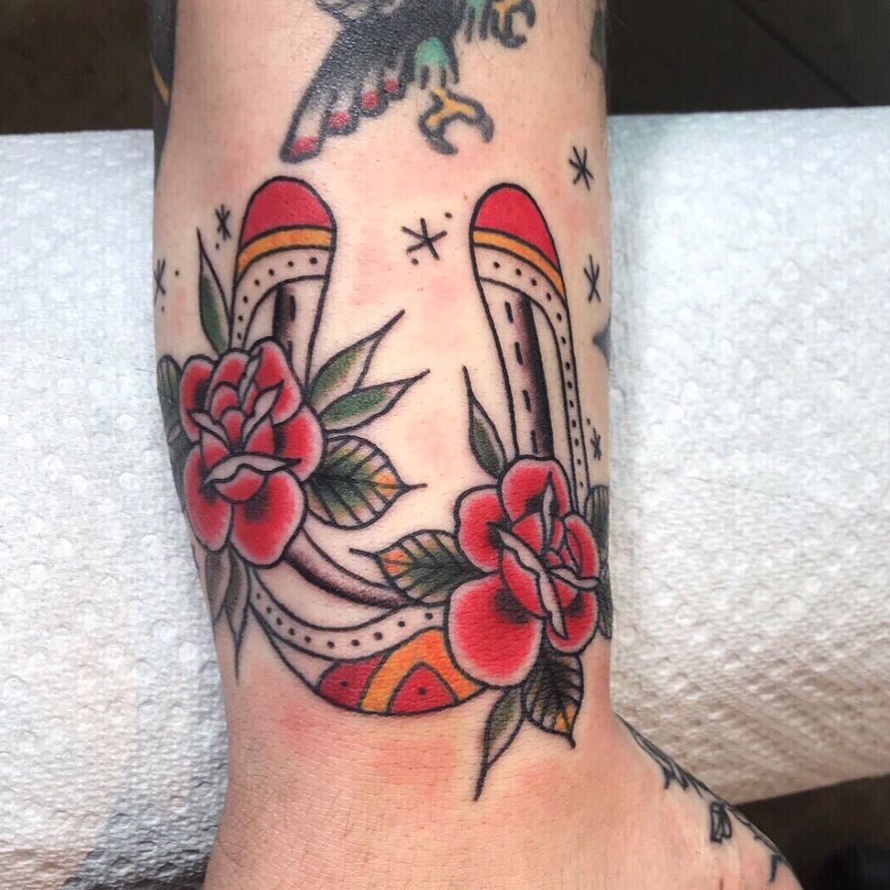 Rocket and roses American traditional tattoo on the forearm by Danielle Dubois