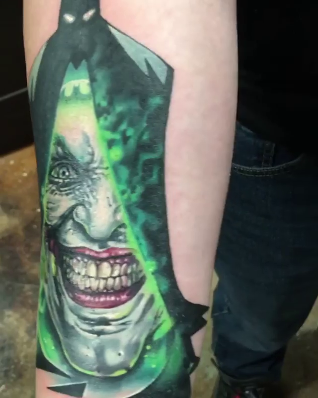 Joker and Batman silhouette realism tattoo by Abel Deida