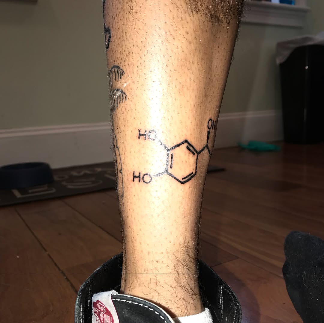 Dopamine molecule geometric tattoo on the forearm by @beantowntats