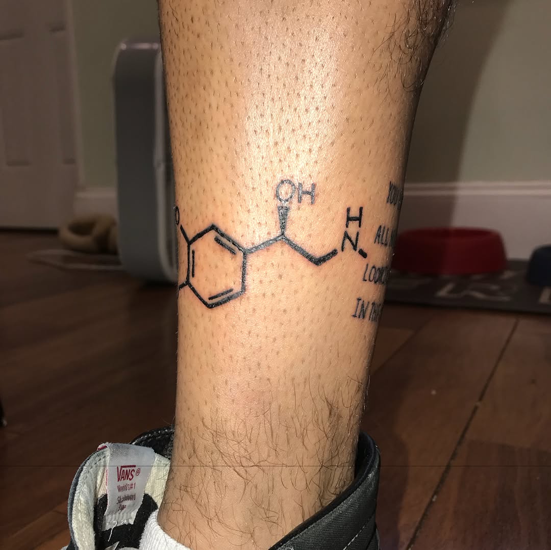 Chemical structure and text tattoo on the forearm by @beantowntats