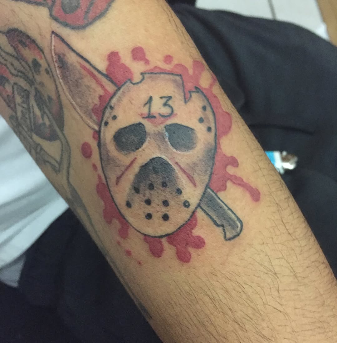 Jason voorhees mask trash polka tattoo on the forearm by Junior Trevino