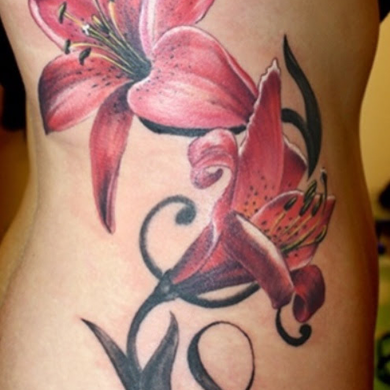 Lily realism tattoo on the ribs by Junior Trevino