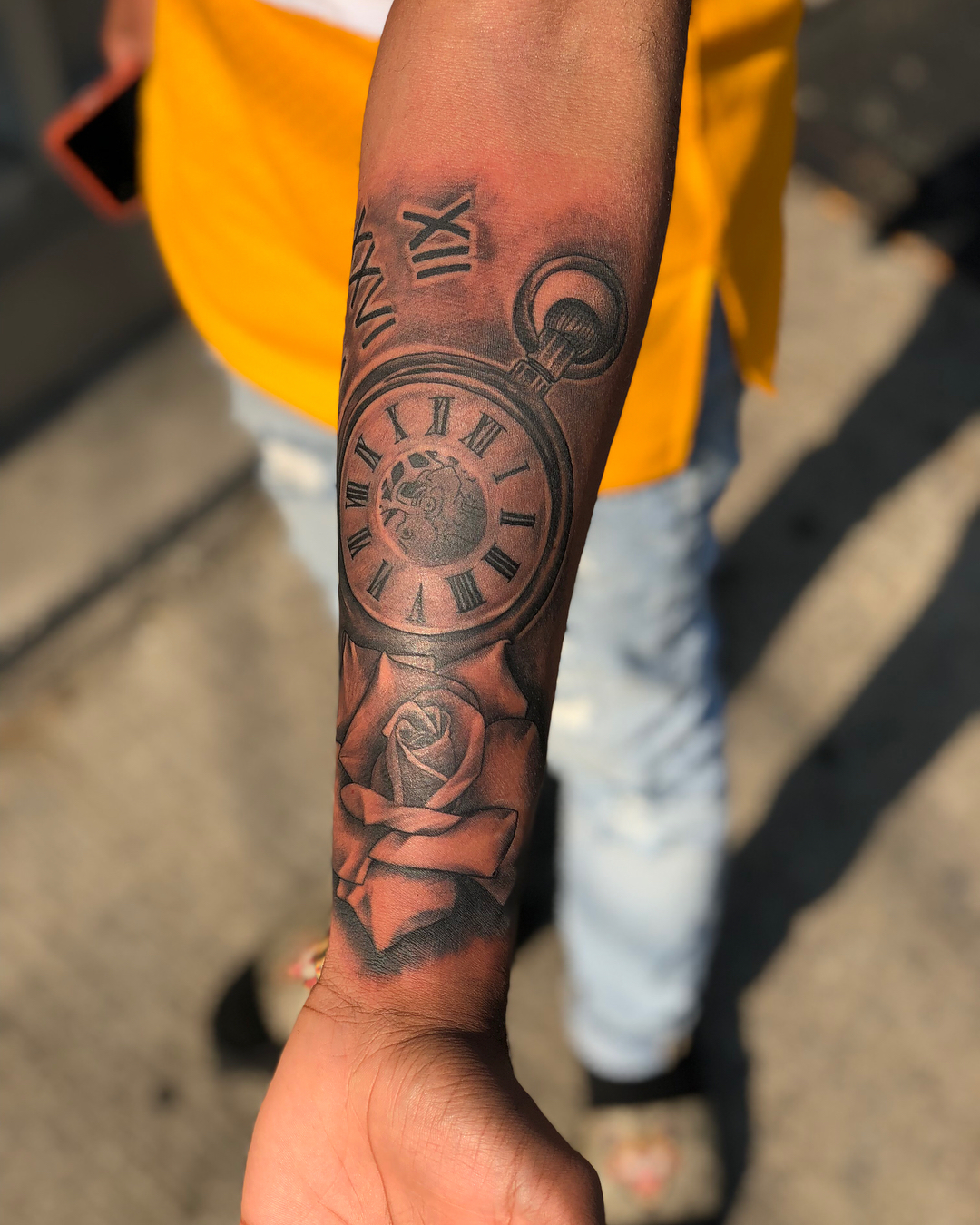 Clock and rose black and grey tattoo on the forearm by DJ 👨🏾‍🎨