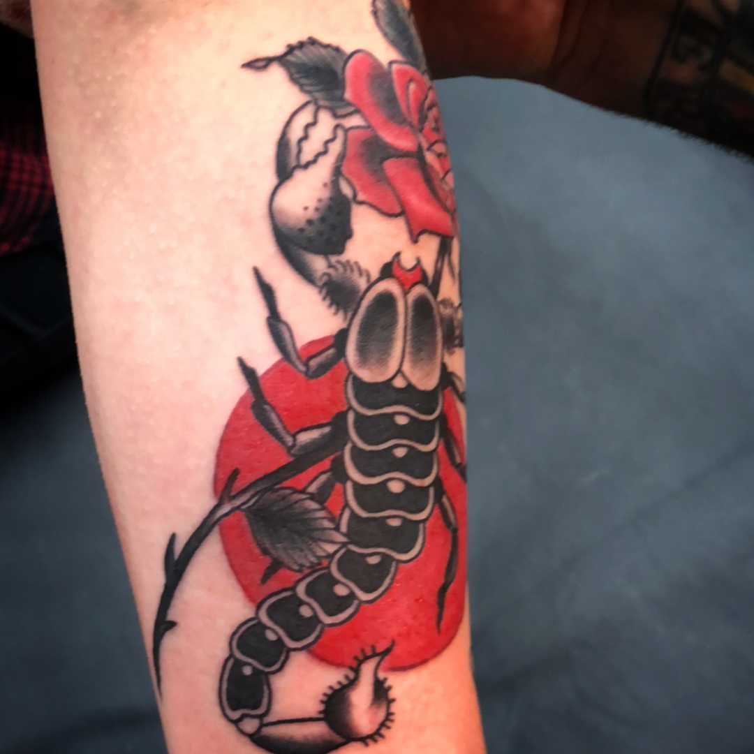 Scorpion and rose American traditional tattoo on the forearm by Danielle Dubois