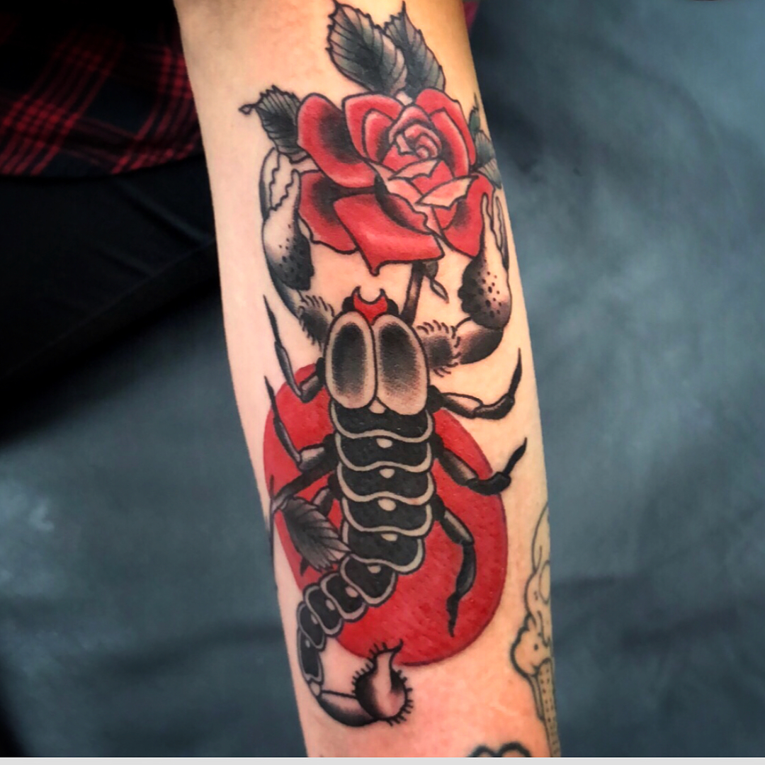 Scorpion and rose American traditional tattoo on the forearm by Danielle Dubois