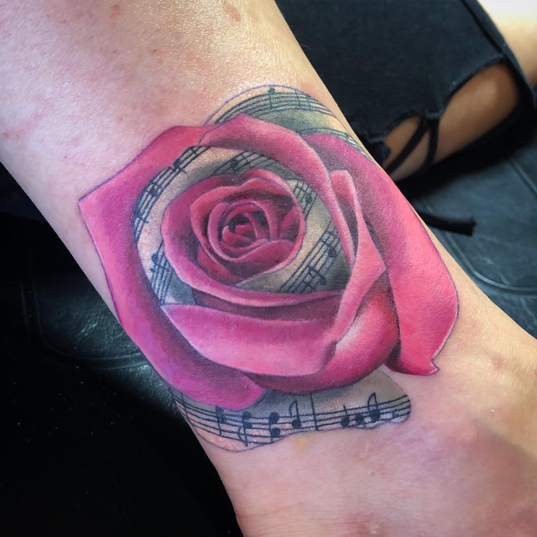 Rose realism tattoo on the forearm by alexandra